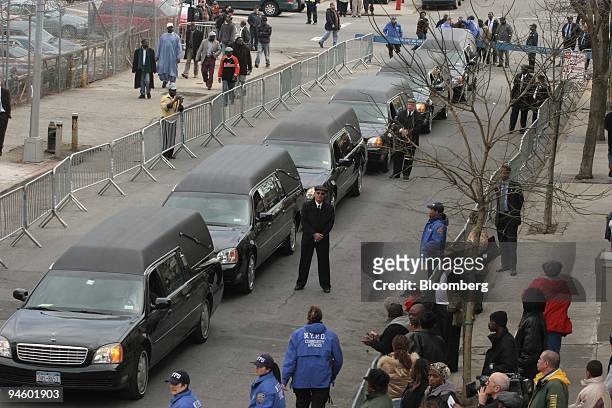 The funeral procession for the Magassa and Soumare families are lined up outside of a Bronx funeral home in the Bronx borough of New York, on Monday,...
