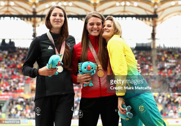 Silver medalist Eliza McCartney of New Zealand, gold medalist Alysa Newman of Canada and bronze medalist Nina Kennedy of Australia pose during the...