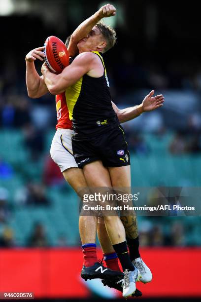 Josh Caddy of the Tigers takes a mark during the round four AFL match between the Richmond Tigers and the Brisbane Lions at Melbourne Cricket Ground...