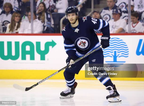 Joel Armia of the Winnipeg Jets keeps an eye on the play during second period action against the Minnesota Wild in Game Two of the Western Conference...