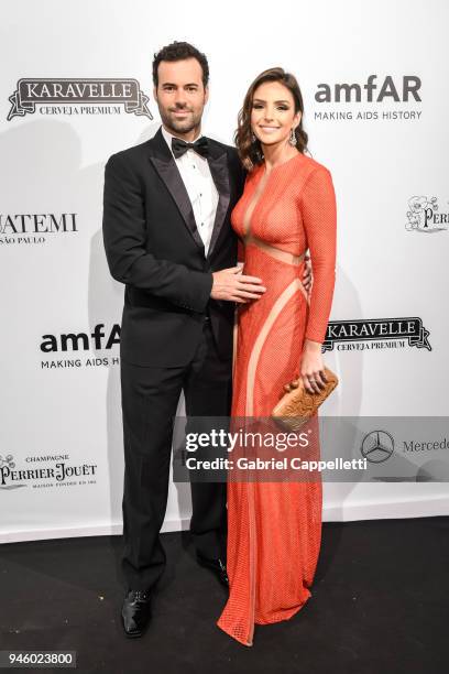 Eduardo Scarpa and Caroline Celico attends the 2018 amfAR gala Sao Paulo at the home of Dinho Diniz on April 13, 2018 in Sao Paulo, Brazil.