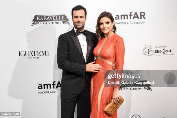 Eduardo Scarpa and Caroline Celico attends the 2018 amfAR gala Sao Paulo at the home of Dinho Diniz on April 13, 2018 in Sao Paulo, Brazil.