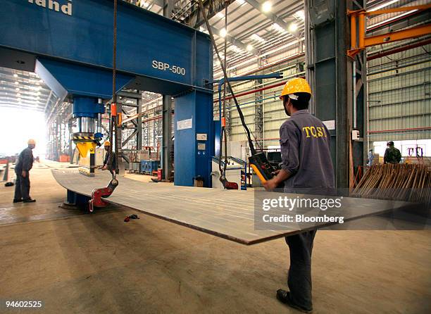 Workers bend steel at the Titan Quanzhou Shipyard Co. Ltd., in Quanzhou, Fujian province, China, on Sunday, Oct. 7, 2007. Titan Petrochemicals Group...