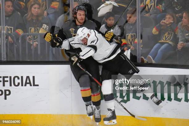 Torrey Mitchell of the Los Angeles Kings checks Colin Miller of the Vegas Golden Knights in Game Two of the Western Conference First Round during the...