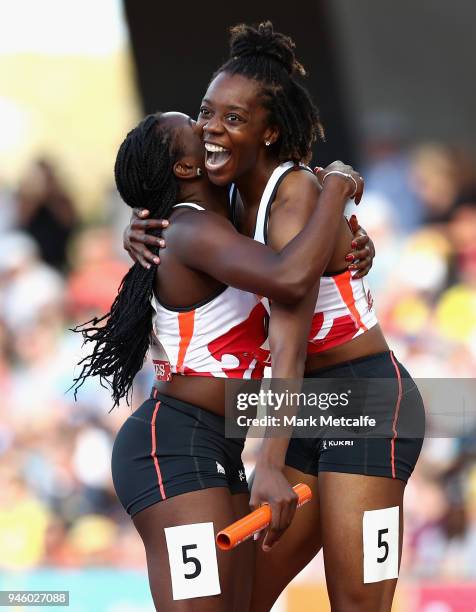 Lorraine Ugen and Asha Philip of England celebrate as they win gold in the Women's 4x100 metres relay final during athletics on day 10 of the Gold...