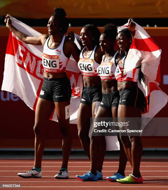 Lorraine Ugen, Bianca Williams, Dina Asher-Smith and Asha Philip of England of England celebrate as they win gold in the Women's 4x100 metres relay...