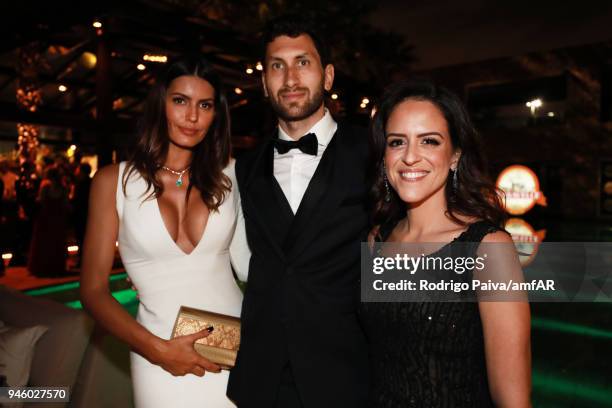 Brena Costa, Karim Al-Fayed and Paula Bezerra de Mello attend the 2018 amfAR gala Sao Paulo at the home of Dinho Diniz on April 13, 2018 in Sao...