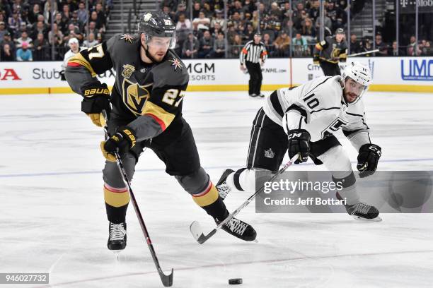 Shea Theodore of the Vegas Golden Knights skates with the puck while Tobias Rieder of the Los Angeles Kings defends in Game Two of the Western...