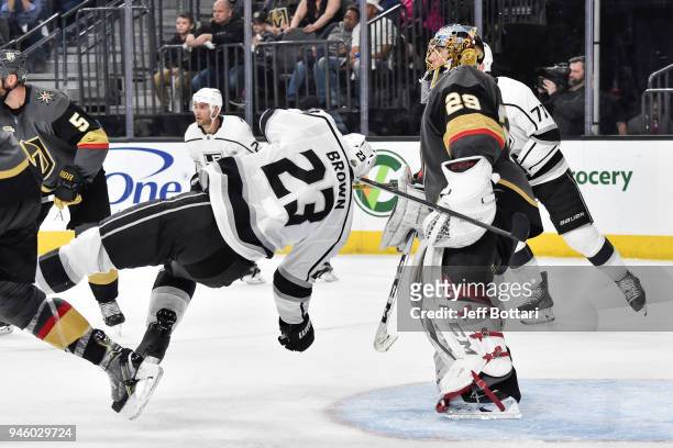 Dustin Brown of the Los Angeles Kings is checked near Marc-Andre Fleury of the Vegas Golden Knights in Game Two of the Western Conference First Round...