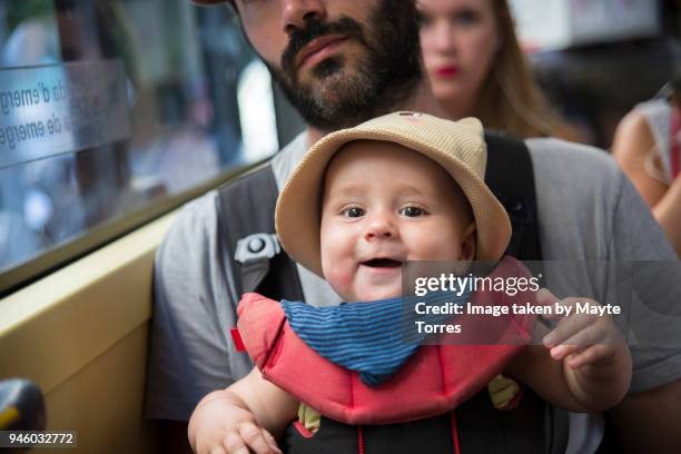 baby boy being carried by dad at the bus - mini bus stock-fotos und bilder