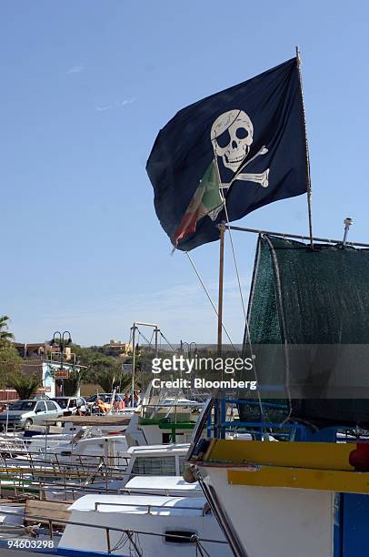 The "Jolly Roger" flies on a boat in the marina in Lampedusa, Italy, Monday, Septemger 4, 2006. With its sun-kissed beaches and crystal-clear sea,...
