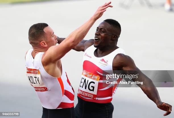 Harry Aikines-Aryeetey and Richard Kilty of England celebrate as they win gold in the Men's 4x100 metres relay final during athletics on day 10 of...