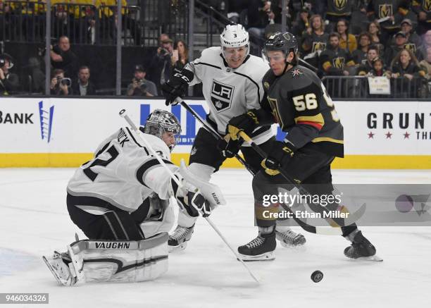Jonathan Quick of the Los Angeles Kings blocks a Vegas Golden Knights' shot as Dion Phaneuf of the Kings and Erik Haula of the Golden Knights look...