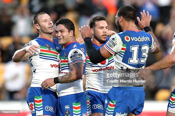 Blake Green of the Warriors celebrates scoring a try with his team mates during the round six NRL match between the New Zealand Warriors and the...