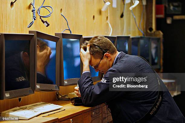 Trader works near a row of unused monitors on the floor of the New York Stock Exchange, Wednesday, May 9 in New York. U.S. Stocks erased their gains...