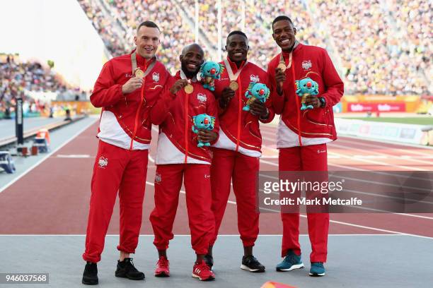 Gold medalists Reuben Arthur, Zharnel Hughes, Richard Kilty and Harry Aikines-Aryeetey of England celebrate during the medal ceremony for the Mens...