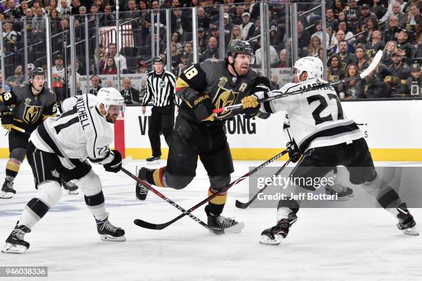 Torrey Mitchell and Alec Martinez of the Los Angeles Kings defend James Neal of the Vegas Golden Knights in Game Two of the Western Conference First...