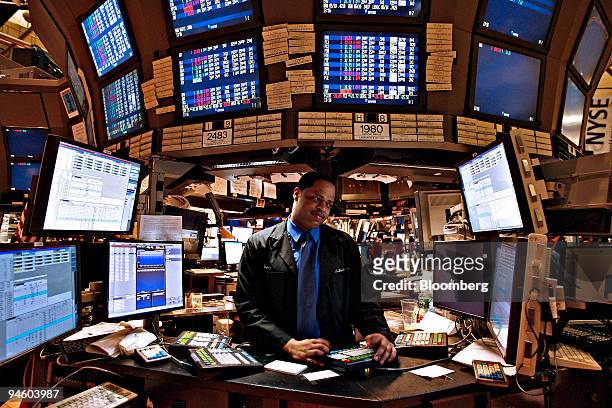 Jerry Stynze works at his post on the floor of the New York Stock Exchange, Wednesday, May 9 in New York. U.S. Stocks erased their gains after the...