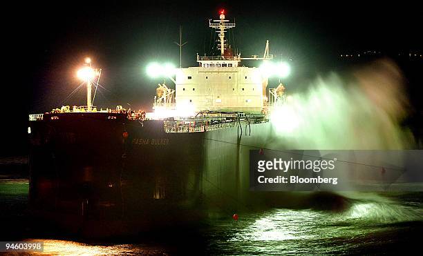 The bulk tanker container ship Pasha Bulker is hit by waves during a night-time refloating attempt on Nobby's beach at the entrance to Newcastle...