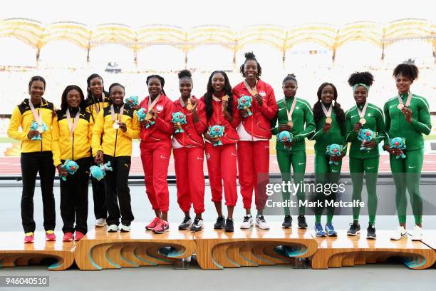 Silver medalists Christania Williams, Natasha Morrison, Gayon Evans and Elaine Thompson of Jamaica, gold medalists Asha Philip, Dina Asher-Smith,...