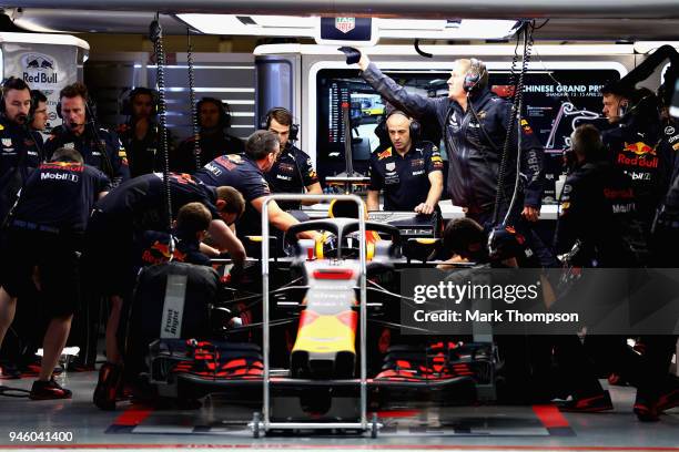 Daniel Ricciardo of Australia and Red Bull Racing prepares to drive in the garage during qualifying for the Formula One Grand Prix of China at...