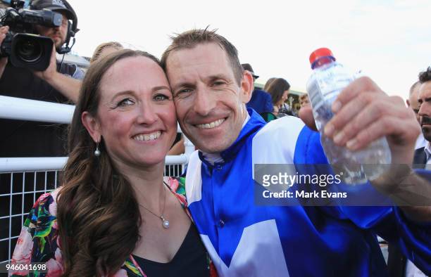 Hugh Bowman hugs wife Christine after winning race 7 The Queen Elizabeth Stakes during day two of The Championships as part of Sydney Racing at Royal...