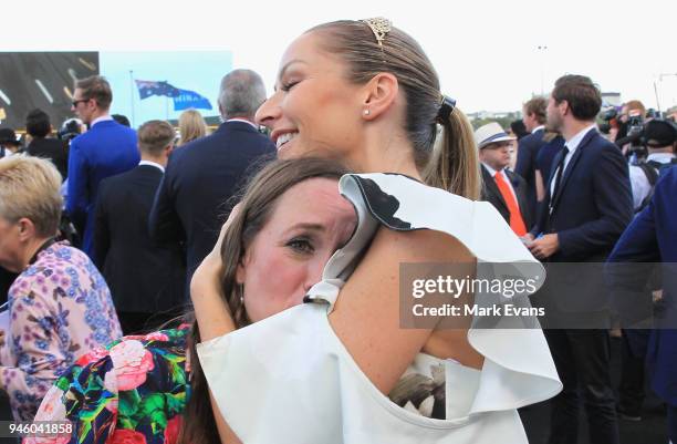 Stephanie Waller, wife of Chris Waller, hugs Christine Bowman after Winx won The Queen Elizabeth Stakes during day two of The Championships as part...