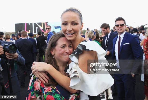 Stephanie Waller, wife of Chris Waller, hugs Christine Bowman after Winx won The Queen Elizabeth Stakes during day two of The Championships as part...