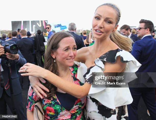 Stephanie Waller, wife of Chris Waller, hugs Christine Bowman after Winx won The Queen Elizabeth Stakes during day two of The Championships as part...