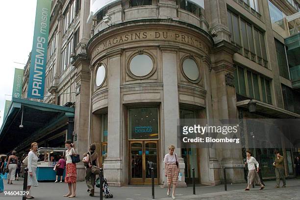 Pedestrians pass a Printemps store in Paris, France, Tuesday, June 20, 2006. PPR SA, the French owner of Gucci Group NV, is in exclusive talks to...