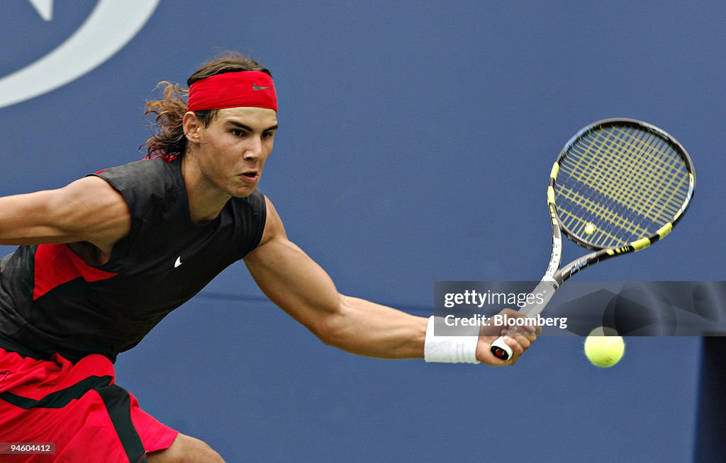 Rafael Nadal of Spain returns a ball to Mark Philippoussis o