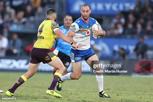 Simon Mannering of the Warriors is tackled by Jack Bird of the Broncos during the round six NRL match between the New Zealand Warriors and the...