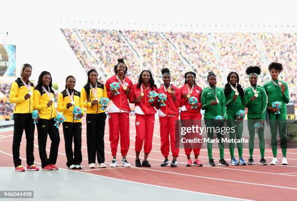 Silver medalists Christania Williams, Natasha Morrison, Gayon Evans and Elaine Thompson of Jamaica, gold medalists Asha Philip, Dina Asher-Smith,...