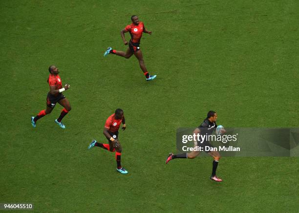 Sione Molia of New Zealand makes a break through the Kenya defence during Rugby Sevens Men's Pool C match between New Zealand and Kenya on day 10 of...