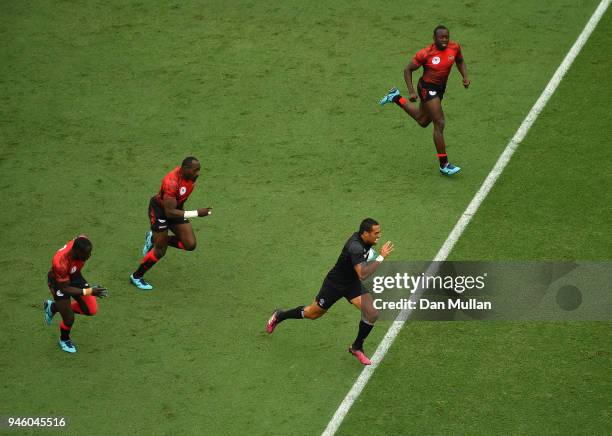 Sione Molia of New Zealand makes a break through the Kenya defence during Rugby Sevens Men's Pool C match between New Zealand and Kenya on day 10 of...