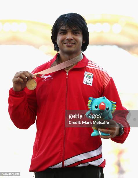 Gold medalist Neeraj Chopra of India celebrates during the medal ceremony for the Mens Javelinduring athletics on day 10 of the Gold Coast 2018...