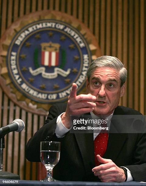 Director Robert Mueller speaks about an investigation into the use of so-called national security letters to collect data, at a news conference at...