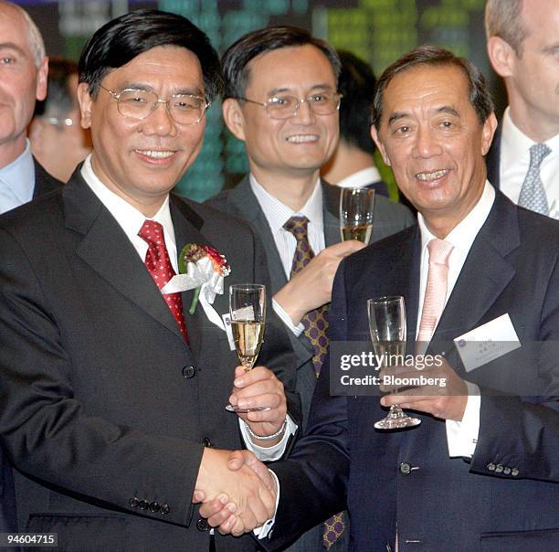 Industrial and Commercial Bank of China Chairman Jiang Jianqing, left, ICBC board member Qian Yingyi, center, and Hong Kong Exchanges and Clearings...