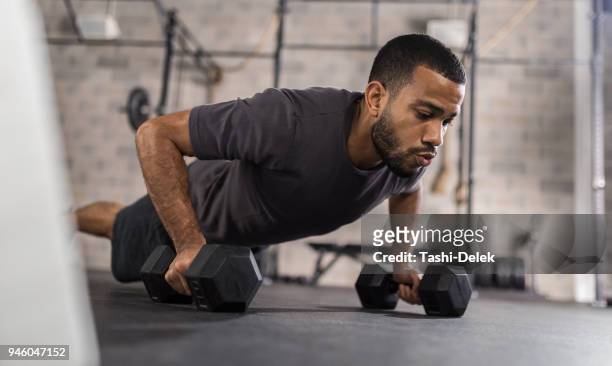 handsome man doing push ups exercise - strong black man stock pictures, royalty-free photos & images