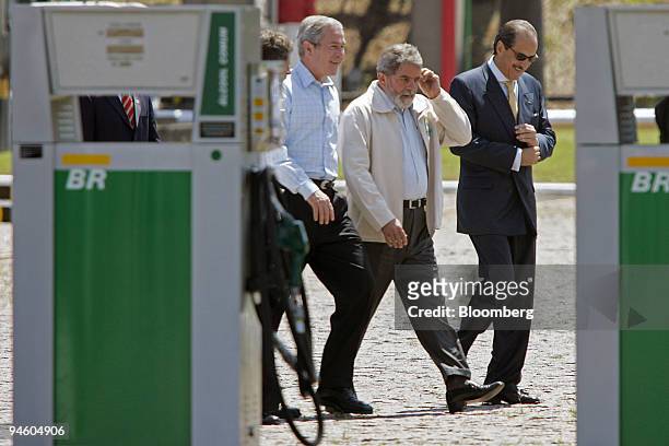 President George W. Bush, left, and Brazilian President Luiz Inacio Lula da Silva, center, visit a Petrobras Transporte S.A. Facility in Sao Paulo,...