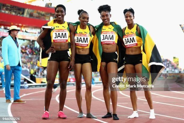 Janieve Russell, Christine Day, Stephenie McPherson and Anastasia Le-Roy of Jamaica celebrate winning gold after the Women's 4x400 metres relay final...