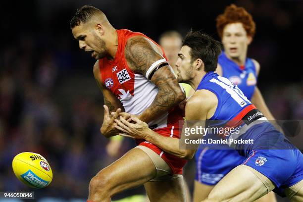 Lance Franklin of the Swans and Easton Wood of the Bulldogs contest the ball during the round four AFL match between the Western Bulldogs and the...