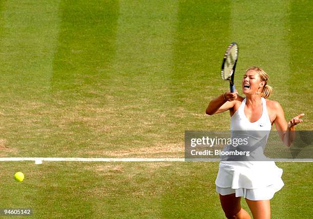 Maria Sharapova of Russia returns to Severine Bremond of France during their Wimbledon Tennis Championships match at the All England Club in London,...