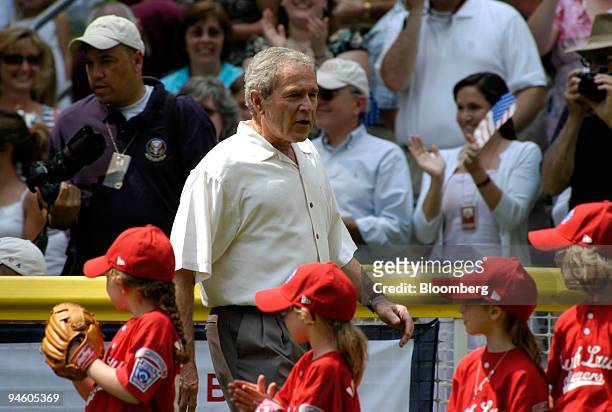 President George W. Bush walks onto the field at the Annual Tee Ball on the South Lawn game at the White House in Washington, D.C., June 27, 2007....