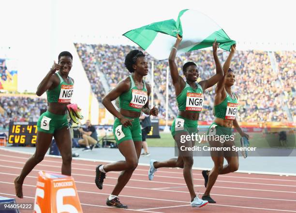 Patience Okon George, Glory Onome Nathaniel, Praise Idamadudu and Yinka Ajayi of Nigeria celebrate winning silver in the Women's 4x400 metres relay...