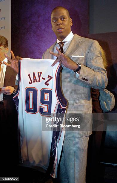 Jay - Z, also known as Shawn Carter, president and chief executive officer of Def Jam Recordings, and part owner of the New Jersey Nets holds up a...