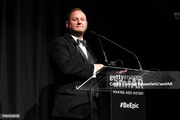 Kevin Robert Frost speaks on stage during the 2018 amfAR gala Sao Paulo at the home of Dinho Diniz on April 13, 2018 in Sao Paulo, Brazil.