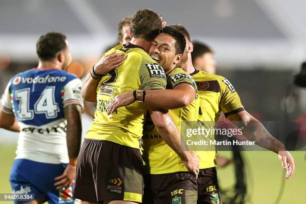 Broncos team mates celebrate after the round six NRL match between the New Zealand Warriors and the Brisbane Broncos at Mt Smart Stadium on April 14,...