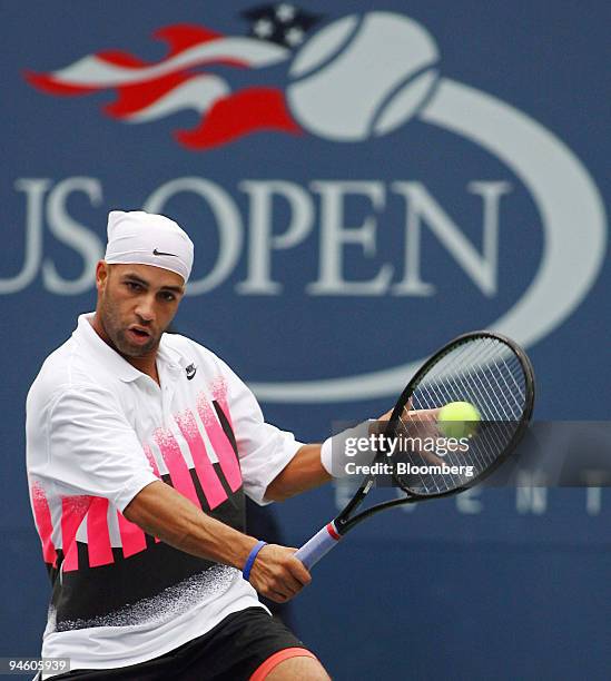 James Blake of the United States returns to Teimuraz Gabashvilli of Russia during their match at the U.S. Open in New York, Friday September 1, 2006...