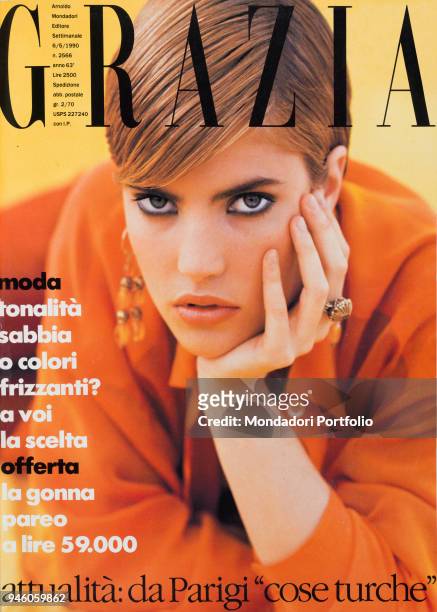 Cover of the women magazine Grazia. Short hair and sophisticated haircut for this model wearing an orange shirt. 1990